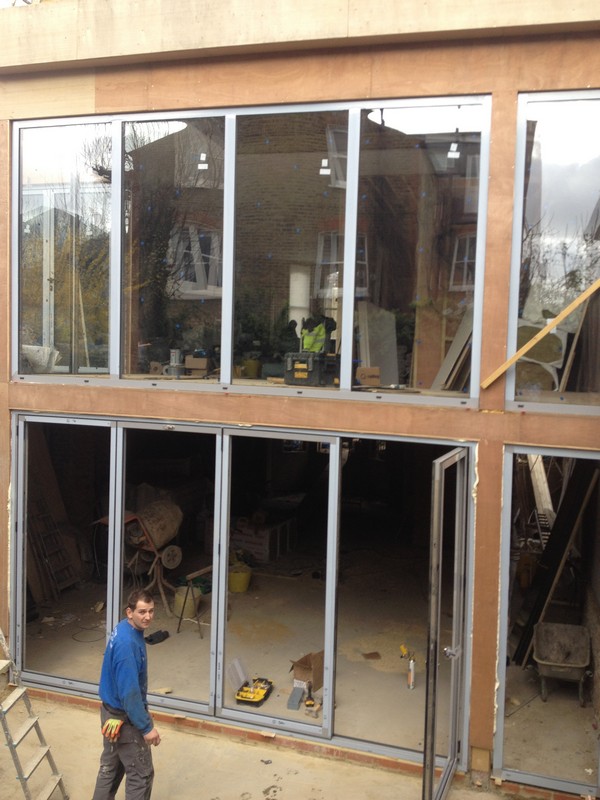 Aluminium bi-fold doors with two-storey glazing in Beaconsfield