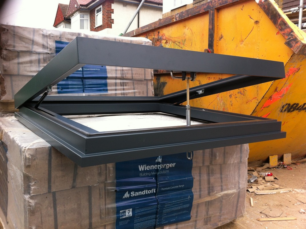 Opening flat roof skylight in anthracite grey installed in Beaconsfield
